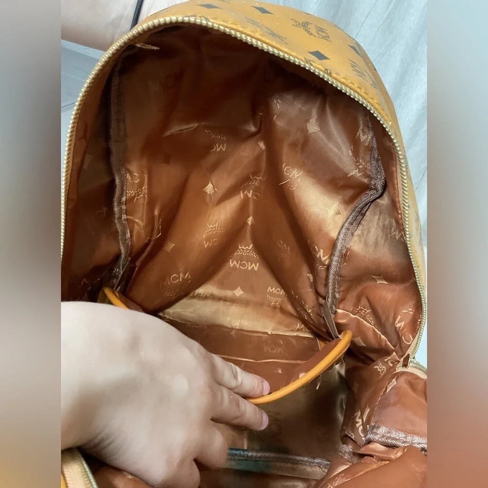 MCM Tan Backpack with Iconic Monogram Design